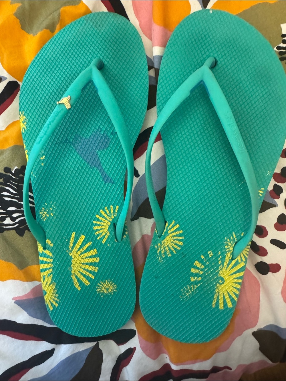 Freewaters Teal Flip Flops with Yellow Sunburst Print and gold bird accent